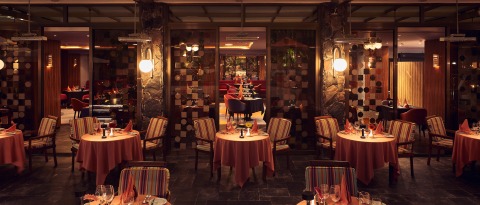 Restaurant Esencia Terrace during night in Seaside Palm Beach